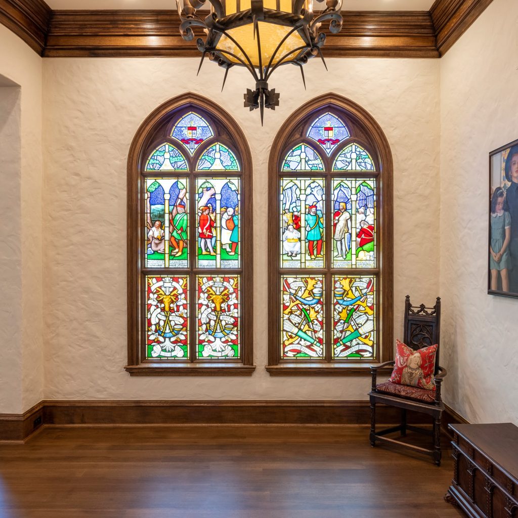 Custom wood window casings surrounding stained glass panels in a traditional home, crafted by Rockwood Door & Millwork in Marietta, Ohio.