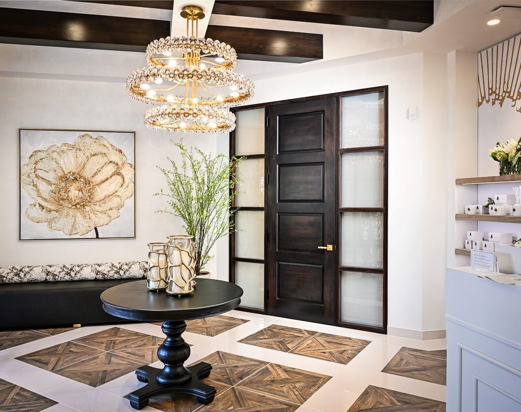 Elegant custom wood door with glass sidelights in Gervasi Spa, Canton, Ohio, crafted by Rockwood Door & Millwork in Millersburg, Ohio.