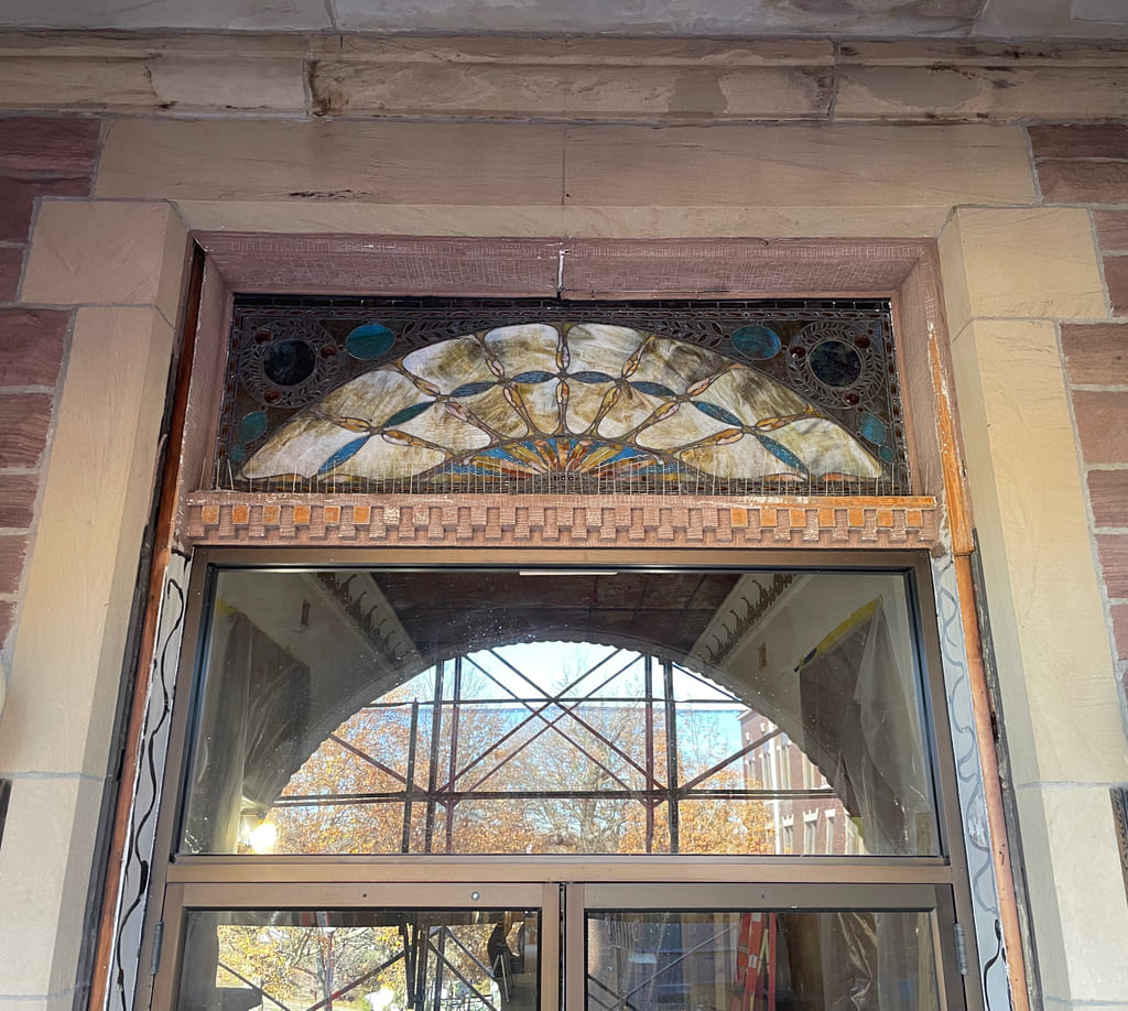 Stained glass transom window above historic courthouse doors at Perry County Courthouse in Ohio restored by Rockwood Door.